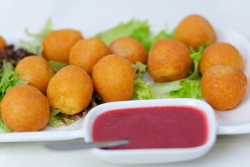 Fried cheese balls with sauce Fast food cheese balls breaded with salt and spices