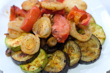Vegan cuisine: Grilled mixed vegetables on a wooden cutting board
