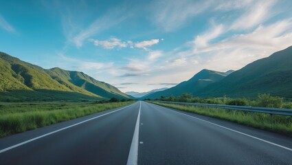 Naklejka premium Vacant asphalt highway amid natural scenery under a blue sky backdrop