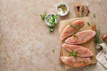 Meat. Raw turkey tenderloin meat, turkey steaks with ingredients for cooking, top view