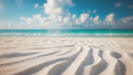 Scenic tropical beach panorama featuring white sand and clear turquoise waters.