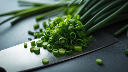 Detailed view of healthy chopped chives and vegetables on the table