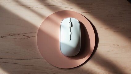 Wireless white mouse on a circular leather mouse pad on a wooden surface
