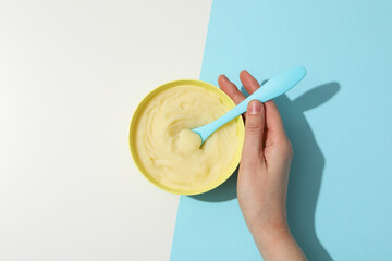 Children's puree from fruits and vegetables, on a blue background.