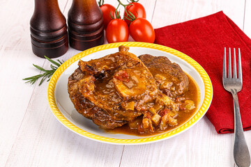 Italian cuisine - ossobuco with sauce