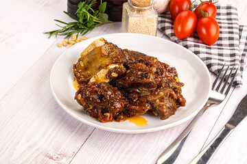 Prepared tasty beef ribs with sauce