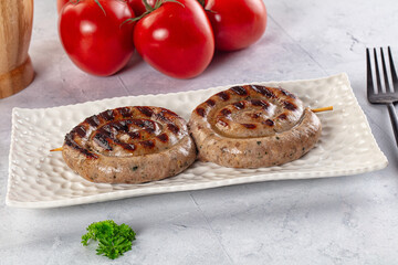 Grilled beef round circle sausages