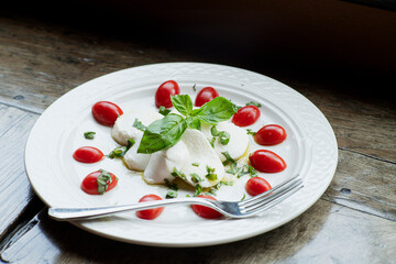 Fresh mozzarella cheese and tomatoes with basil