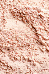 The texture of dry cosmetic clay for masks or cosmetic powder.