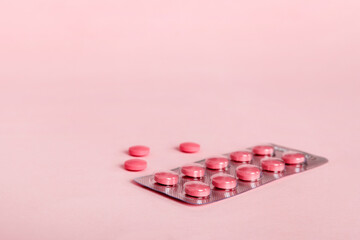 Blister package with Vitamin on color background. Medicine pills on a light background. Medicines...