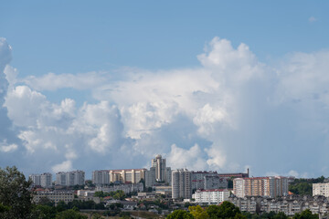 A vibrant urban landscape is on display, characterized by various buildings reaching toward a...