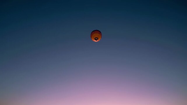 Floating lantern at sunset conveys wishes hope remembrance longing tranquility reflection inspiration