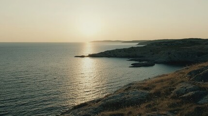 Obraz premium Golden Hour Sunset Over Coastal Cliffs and Ocean