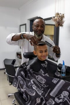 Young boy having his hair trimmed