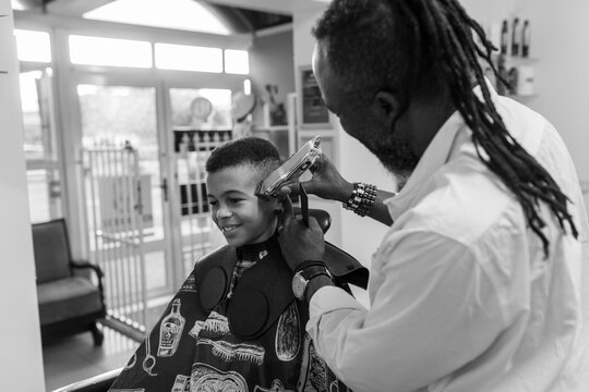 Young boy having his hair cut