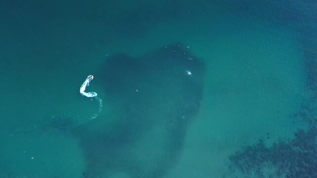 aerial shot of a jet ski over the sea