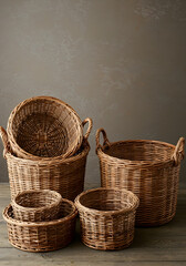 Group of Brown Wicker Baskets Stacked on a Wooden Surface