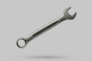 Wrench fly over gray background close up