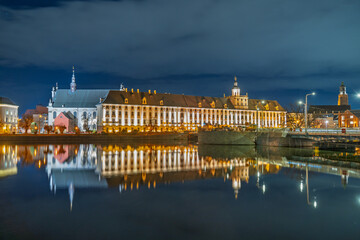 Wrocław University building illuminated at night