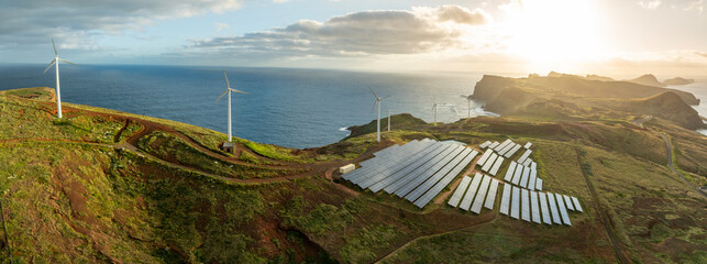 Solar energy panels photovoltaic cell and wind power plants on the seashore landscape for...