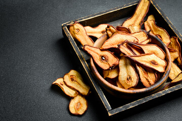 Delicious and healthy sun dried pears on old baking tray. Homemade drying of pears in the summer.