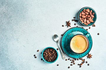 A cup of fragrant coffee. A turquoise cup of Arabica and Robusta coffee. On a gray stone...