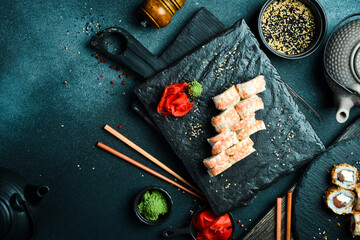Traditional fresh Japanese sushi rolls with shrimp. Served with wasabi sauce and pickled ginger....