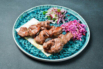 Kebab with vegetables. Grilled lamb shish kebab. Meat dishes.