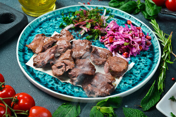 Shish kebab from wild roe deer. Grilled kebab. Meat dishes. Top view.