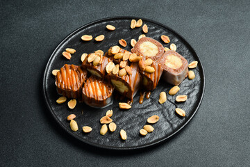 Sweet sushi roll with banana and chocolate. Sushi menu. Japanese food.