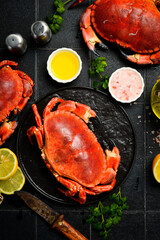 Seafood. Boiled crabs seasoned with lemon, salt and spices. Vertical photo, top view.