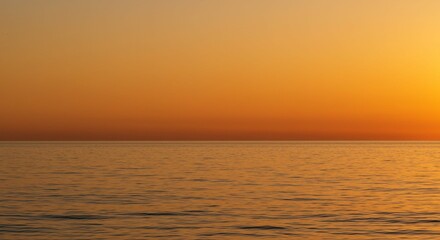 Obraz premium Serene Sunset Over Calm Ocean Waters Golden Hour Seascape