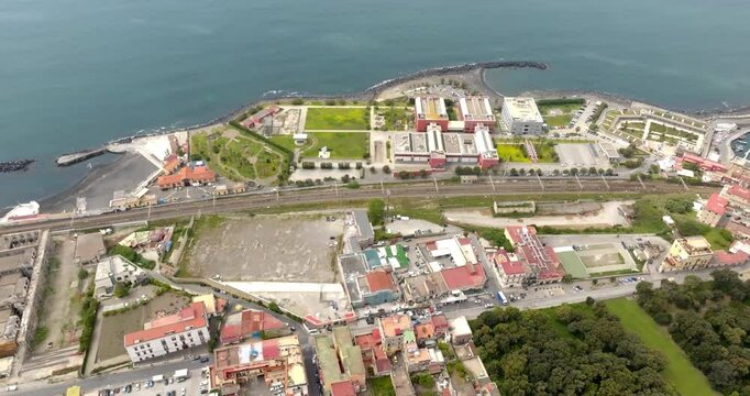 Aerial view of the seafront of the city of Ercolano located in the province of Naples, Campania, Italy. In the background is the Mediterranean sea.