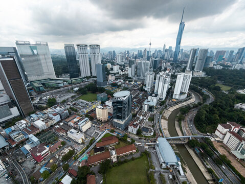 Fototapeta Wide aerial view of river and dense city skyline, Kuala Lumpur, Malaysia