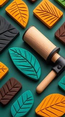 Flat Lay of Linocut Printing Tools and Leaf-Shaped Blocks