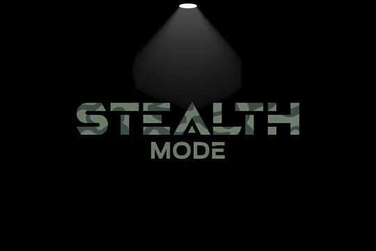 Camouflaged stealth mode typography on a dark background illuminated