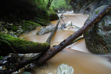 flowing water in a creek over the mountains in tuscany