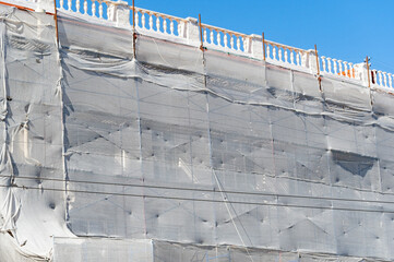 reconstruction building Covered or wrap with Mesh fabric for dus