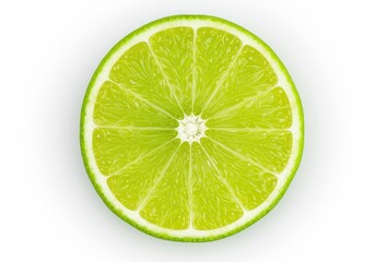 Close-up of a vibrant green lime slice with juicy pulp and rind on a white background