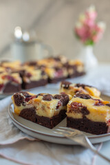 Chocolate cheesecake layered with brownie and dark cherrie