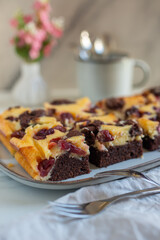 Chocolate cheesecake layered with brownie and dark cherrie