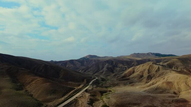 Aerial pull-out view of Calanchi del Cannizzola (or Deserto dei Calanchi), known as the &ldquo;Sicilian desert&rdquo;, a series of clay formations in East Sicily