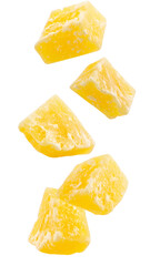 Crystallized pineapple chunks falling with transparent background