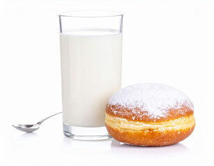 Glass of milk with spoon and a donut with powdered sugar on white background