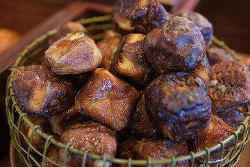 fried puff pastry buns in basket fatty unhealthy food pies puff pastry. High quality photo