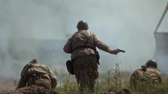 Soviet commander climbs out of trench to battlefield Red Army soldiers move forward under officer command. Political commissar is ahead of attack offensive. Assault of Wehrmacht troops. World War II