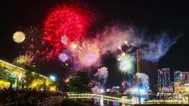 Fireworks display to celebrate the 50th anniversary of Vietnam's reunification. Beautiful night view cityscape. Holidays, independence day, New Year