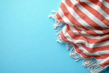Red and White Striped Beach Towel on Blue Background Summer Vacation Texture Coastal Fabric