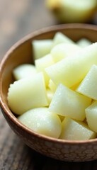 Sharp white onion pieces in a bowl, glistening , raw, aromatic