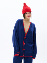 girl model in stylish clothes on a white background in the studio, fashion shooting.